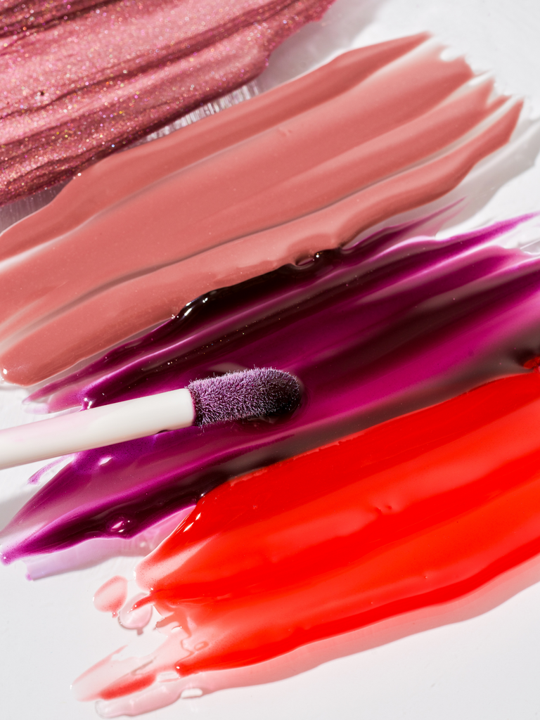 Various shades of sheer plum lip gloss