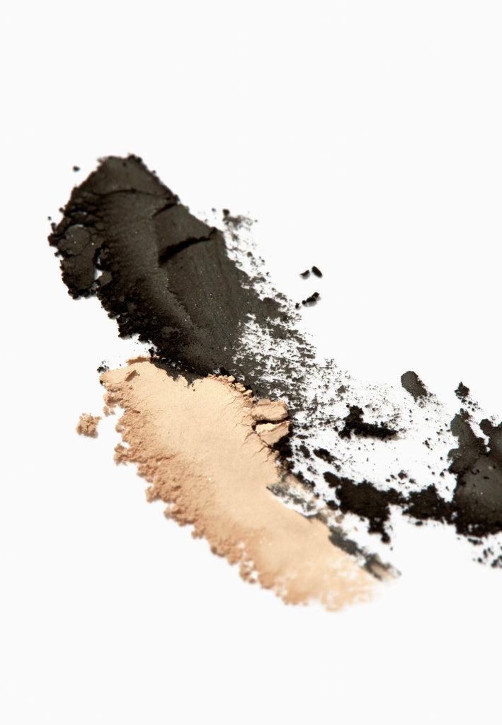 creamy beige matte and black color of eyeshadow powder